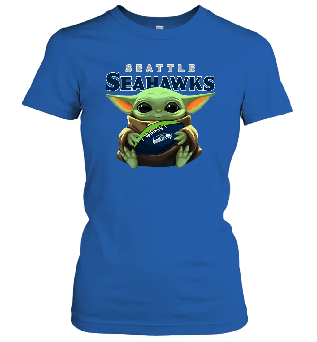 Baby Yoda Loves The Seattle Seahawks Star Wars Baby Yoda Hugs Seahawks NFL Womens T-Shirt