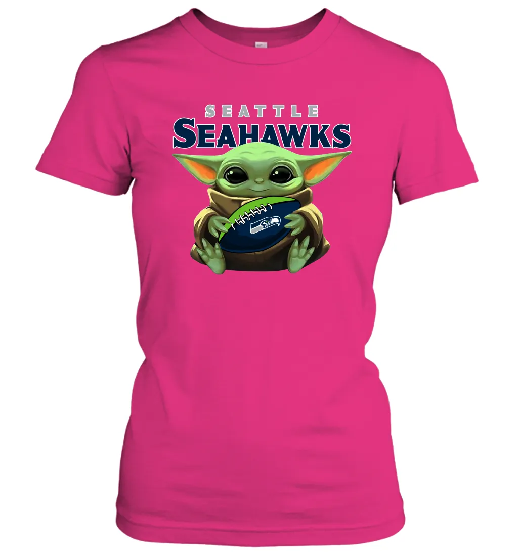 Baby Yoda Loves The Seattle Seahawks Star Wars Baby Yoda Hugs Seahawks NFL Womens T-Shirt