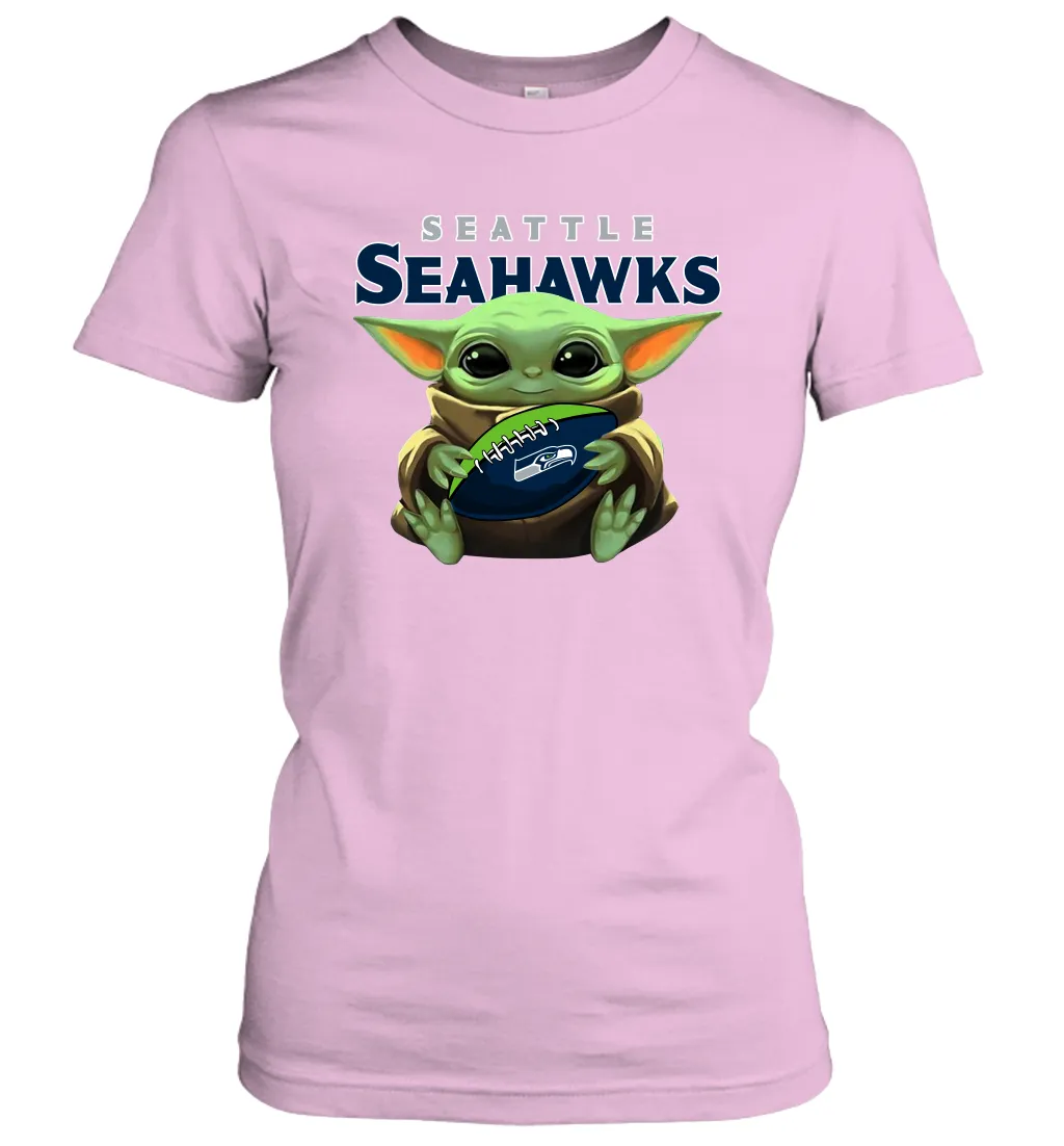 Baby Yoda Loves The Seattle Seahawks Star Wars Baby Yoda Hugs Seahawks NFL Womens T-Shirt