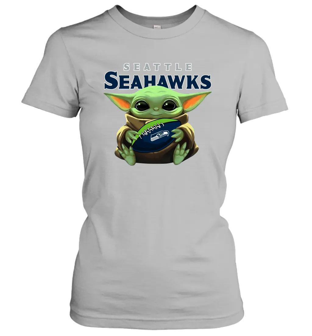 Baby Yoda Loves The Seattle Seahawks Star Wars Baby Yoda Hugs Seahawks NFL Womens T-Shirt