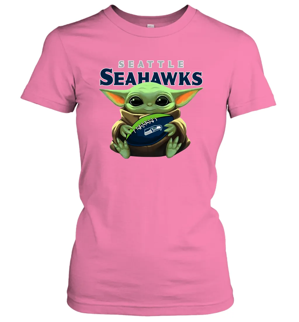 Baby Yoda Loves The Seattle Seahawks Star Wars Baby Yoda Hugs Seahawks NFL Womens T-Shirt